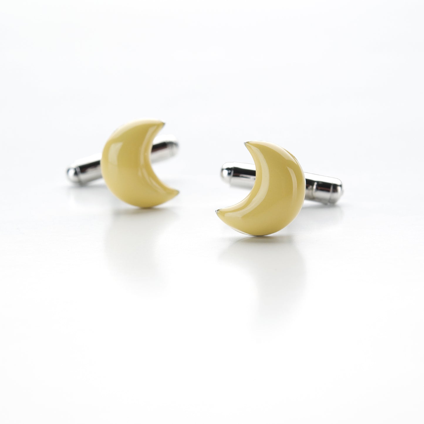 Crescent moon cufflinks in silver and yellow enamel