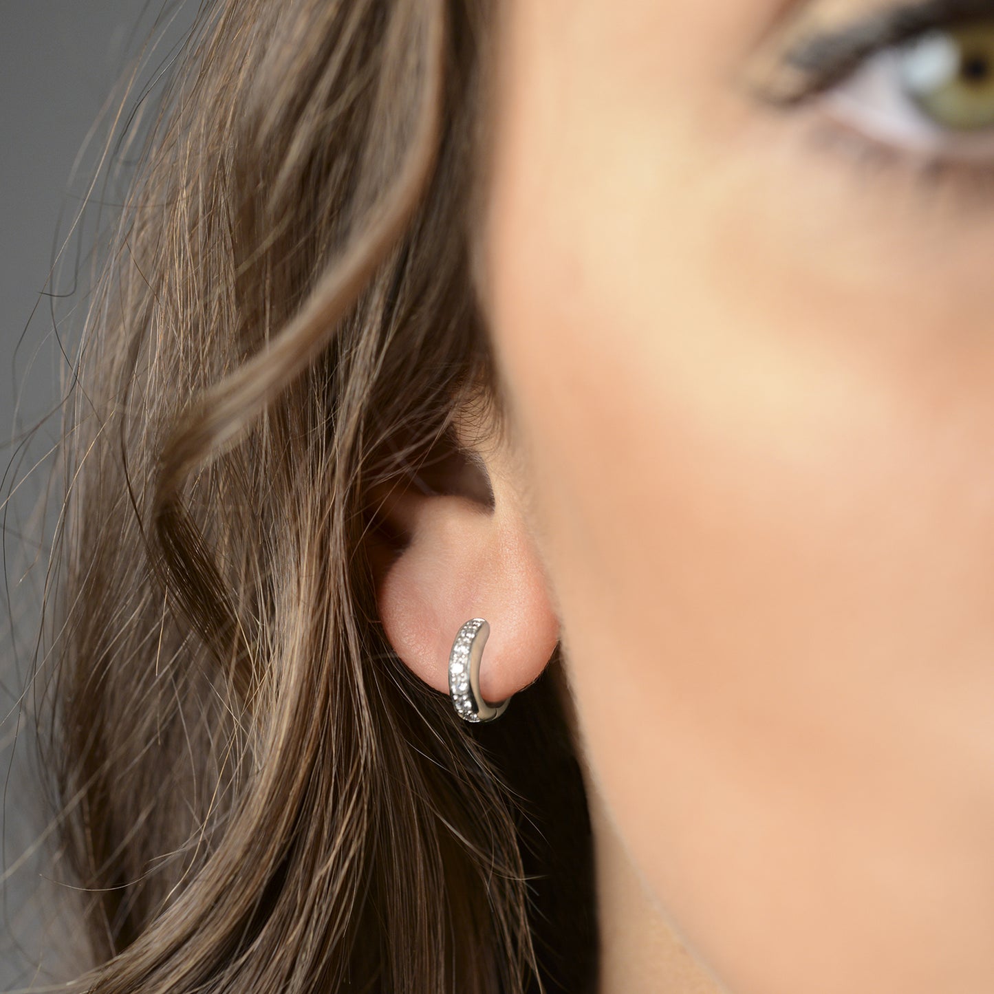 Bold huggie hoop earrings with diamonds