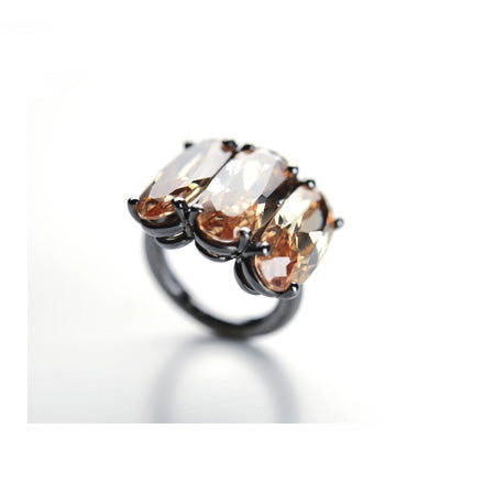 Trilogy ring in sterling silver and golden zircons
